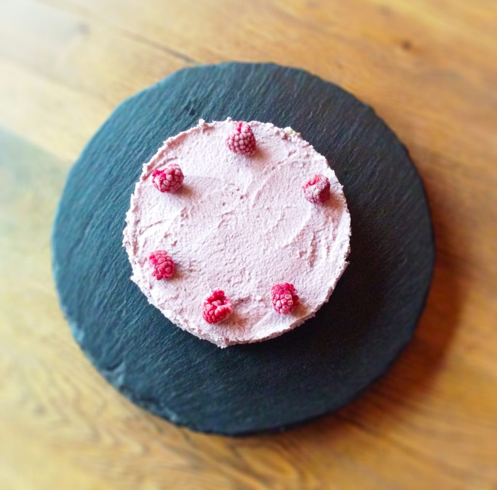 Clean raspberry cheesecake topped with raspberries | Real Food Real Health UK